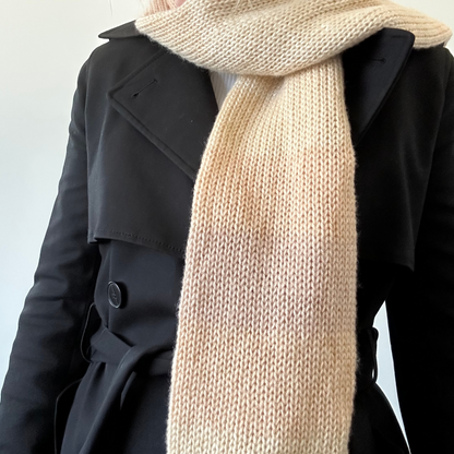 Soft and cozy knitted scarf in muted ombre shades